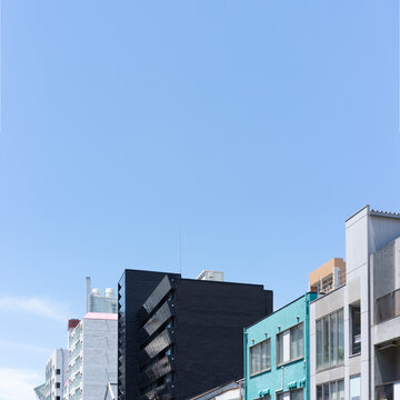 Building facades against blue sky with copy space in Fukuoka, Japan