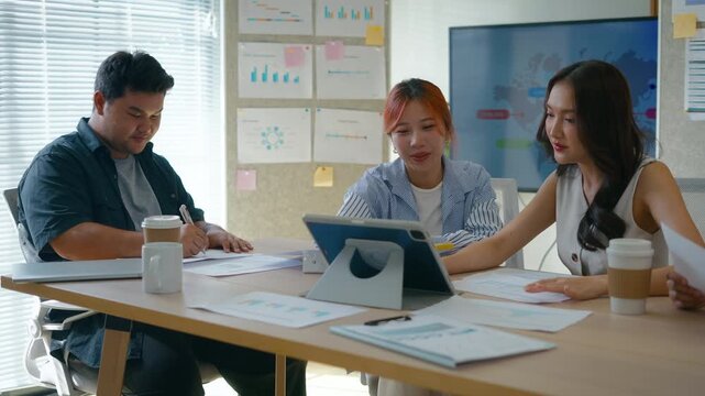 Group of creative Businesspeople brain storm meeting presentation,discussing roadmap to product launch, planning,strategy,dashboard,new business development,working with new startup project in office