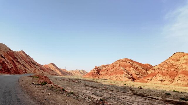 Driving through the colorful badlands of ALTASHI Geopark, Xinjiang