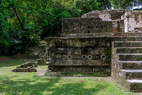 Teotihuacan talud tablero architecture style with Tlaloc rain god in Mayan temple of the Lost World, Tikal, Guatemala.
