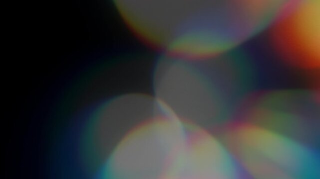 A light flare effect from particles moving from right to left. Suitable for video applications, video stylization, and transitions. Bokeh overlay with lens flare and lens leakage. Blurred rays and lig