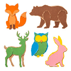 Naklejka premium Creative torn paper collage of woodland animals. Fox, bear, deer, owl, and rabbit isolated on transparent background.