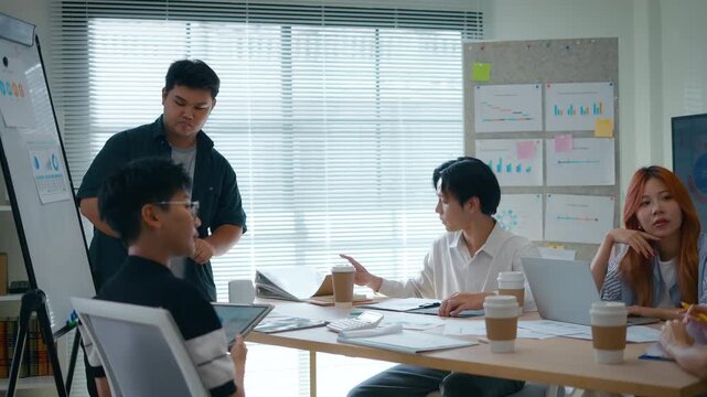 Group of creative Businesspeople brain storm meeting presentation,discussing roadmap to product launch, planning,strategy,dashboard,new business development,working with new startup project in office