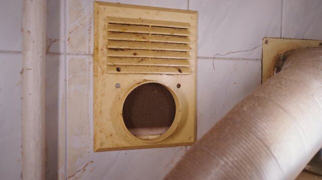 Dirty Ventilation Grille Close-Up: Slow Motion Push In on Clogged Exhaust Vent Covered in Soot | Gas Residue Buildup on Old Air Vent | HVAC Maintenance Problem Detail Shot