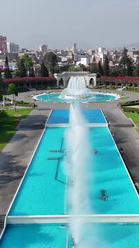 Parque De La Reserva In Lima Capital City Peru. Drone Captures A Garden With Sidewalks Surrounded By Lush Trees. Landmark Town. District Skyline. Lima capital city.
