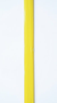 Yellow plastic tube isolated on white background for occupational health safety