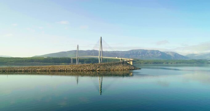 Drone Approaches Helgeland Bridge and Rocky Embankment in Leirfjorden, Norway