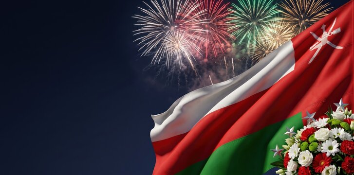 Waving national flag of oman with white, red, and green stripes against a dark night sky with colorful bursting fireworks and a bouquet of red and white flowers