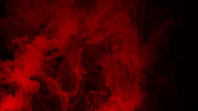 Real Red Smoke on Black Background