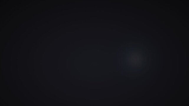 Blue tinted camera flashes scattered on dark background. 4K Video