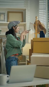 Women use laptop or phone for home office,package and e commerce checklist with stock to customer.Small business people with digital tech,logistics fulfillment,box and phone for online website order