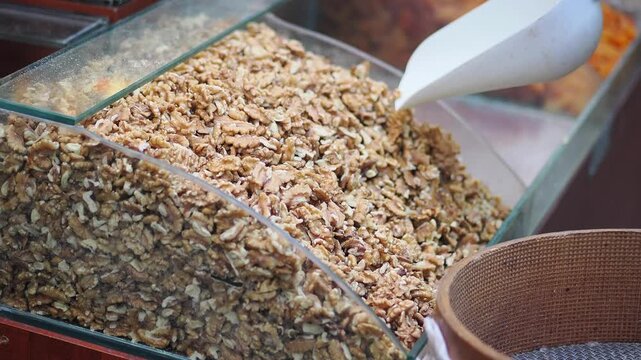 Fresh walnuts in a market stall in the city