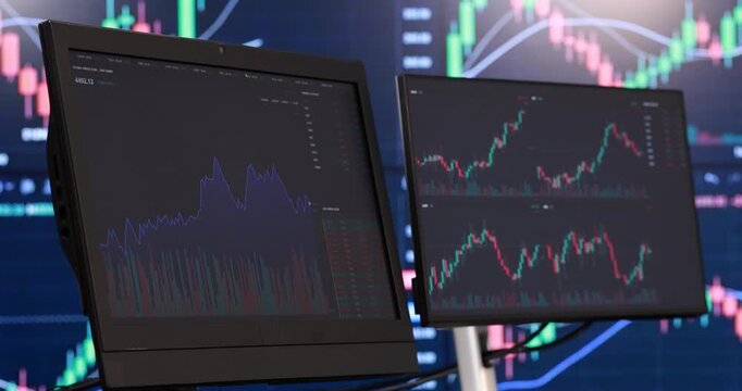 Multiple computer monitors display complex financial data. Glowing screens showcase vibrant red and green candlestick charts, perfectly illustrating live market trends