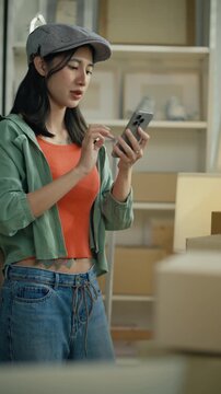 Women use laptop or phone for home office,package and e commerce checklist with stock to customer.Small business people with digital tech,logistics fulfillment,box and phone for online website order