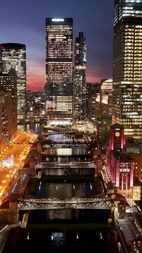 Downtown Chicago In Chicago Illinois United States. Bridge Showcasing The Traffic Flowing Across In The City. Sunset Golden Hour Skyline. Illumination City. Chicago Illinois.