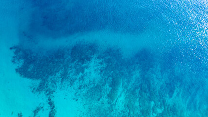 Top view of deep blue sea water surface with small ripples, aerial drone shot of turquoise ocean texture at island , abstract nature background  © Media 