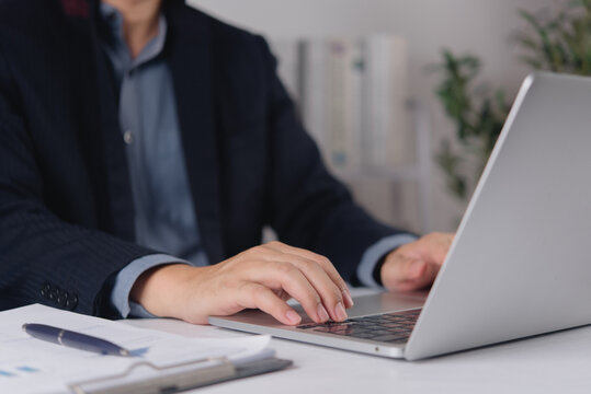 Business Professional Working on Laptop at Office Desk with Documents for Corporate Productivity Digital Workflow and Administrative Work