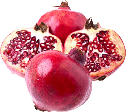 Fresh red pomegranate fruit with juicy arils and natural green
