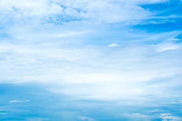 Fototapeta premium Panorama view clear blue sky meets a glowing white horizon, suggesting a serene, open, and with sunlight of beautiful cloudy sky. landscape or nature sky background