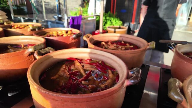 Pots of spicy boiling broth in China