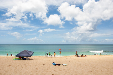 Fototapeta premium People Relaxing at Sunset Beach on Oahu North Shore, Hawaii