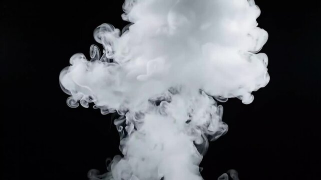 White Smoke Explosion Rising and Expanding Against Black Background Close-Up