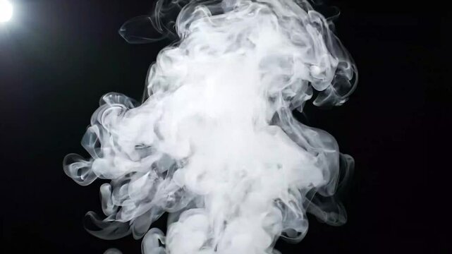 White Smoke Explosion Rising and Expanding Against Black Background Close-Up