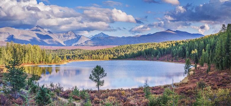 Mountain lake on an autumn evening, cloudy weather, forest