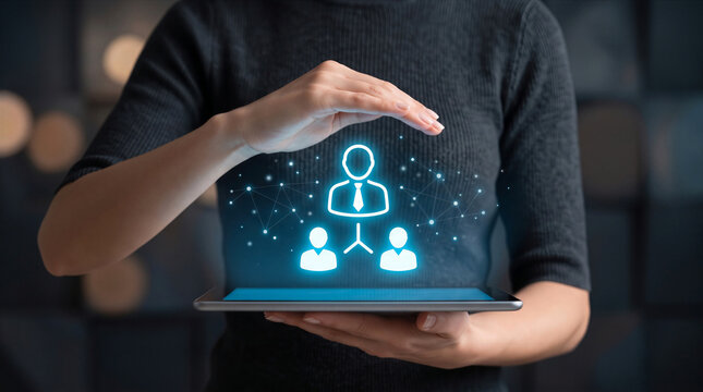 Businesswoman holding tablet with human resources icon for team leadership and recruitment