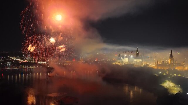 Ottawa, Canada, fireworks over Parliament Hill and the Ottawa River amid heavy smoke, haze and air pollution. g.