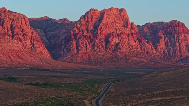 Aerial view of glowing sandstone mountains at sunrise in Red Rock Canyon Nevada