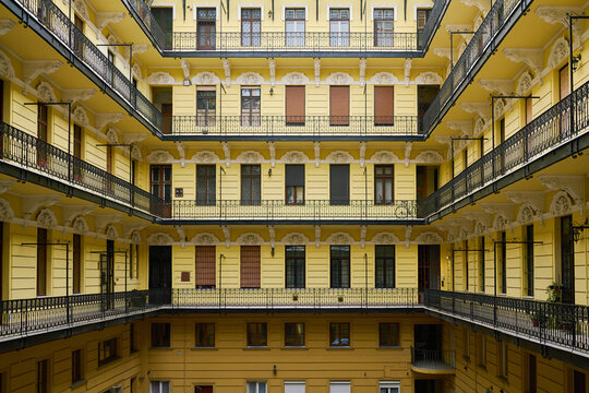 Yellow apartment building with inner courtyard in Budapest