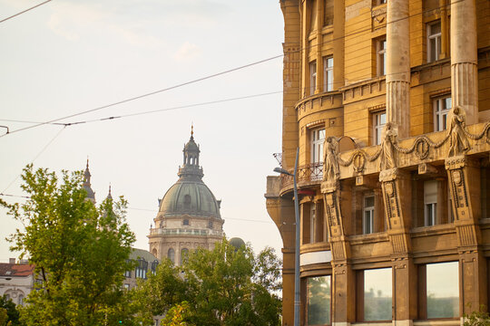 Budapest street architecture with St. Stephen's Basilica dome and ornate facade