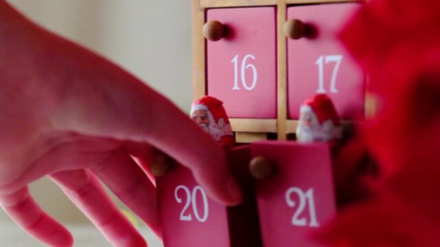 Advent Calendar with Chocolate Santa.Sweets and gifts for the Christmas holidays.Advent calendar fillers for children. 4k footage