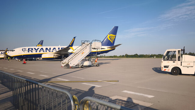 Germany. Karlsruhe Baden-Baden Airport. August 2026. Commercial airplanes Ryanair parked on an airport tarmac with boarding stairs. Aviation and air travel concept