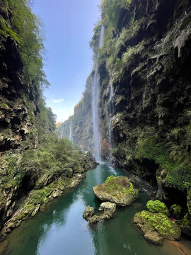 Maling River Canyon in Guizhou, known as "The Most Beautiful Scar on Earth." A breathtaking natural wonder featuring stunning limestone cliffs draped with over a hundred cascading waterfalls