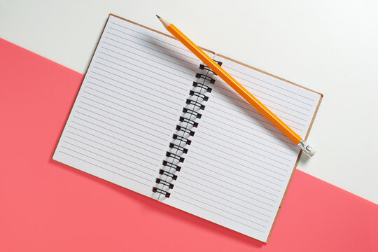 Open Notebook with Pencil