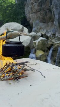 Therapeutic Nature Retreat: Campfire Tea Brewing Next to Cold Mountain Stream