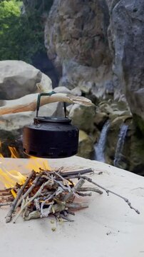 Relaxing Outdoor Lifestyle: Boiling Water on Wood Fire in a Mystical Hidden Canyon