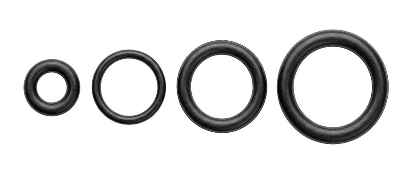 Black rubber o ring seals set in various sizes lined up on isolated white background for plumbing repair, mechanical engineering, industrial hardware maintenance, and automotive equipment leak prevent