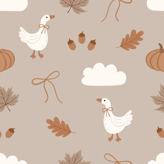 Fototapeta premium Cute white goose seamless pattern featuring ducks wearing bows, maple and oak leaves, pumpkins, acorns, fluffy clouds, and line ribbons on a warm beige background. 