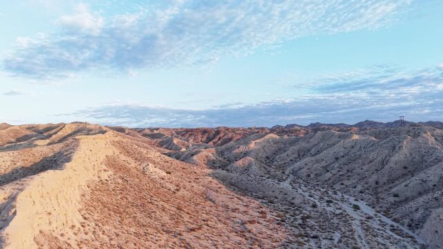 Slow aerial glide over the sands of the Mojave Desert near Laughlin Nevada revealing stunning picturesque views of this magnificent Desert at sunrise