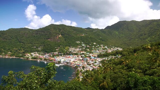 Beautiful overlook of Soufri&egrave;re Bay in Saint Lucia, with the colorful village, tropical greenery, and the Piton mountain shaping the horizon along the Caribbean Sea.