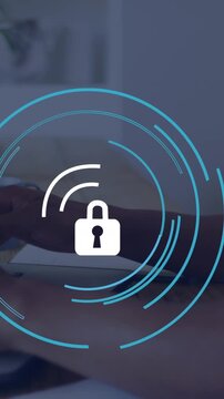 Animation of padlock icon over caucasian businessman using laptop in office