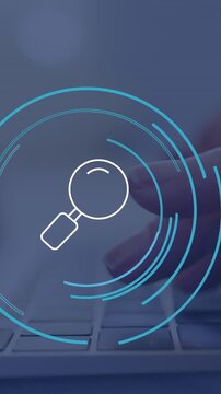 Animation of reading glass icon over caucasian businesswoman using laptop in office