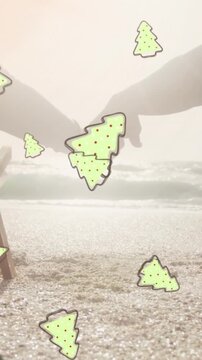 Animation of ginger bread icons over senior couple at beach