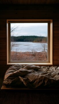 Tranquil lakeside cabin interior evokes peace with soft light and simple natural design elements