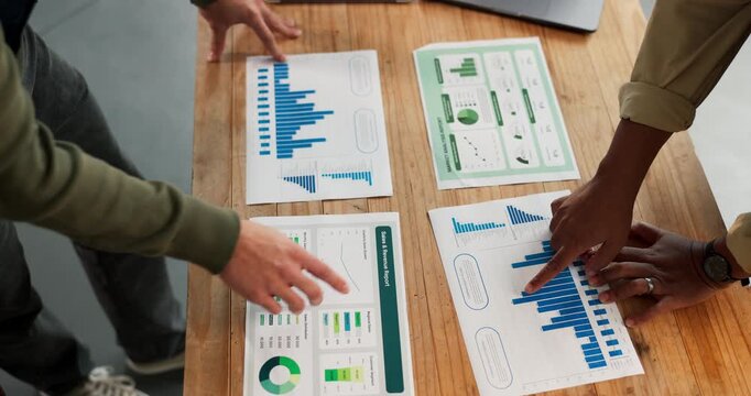 Meeting, data or hands in office with paper, forecast discussion or growth plan in finance review. People, above or analyst team with document, budget outlook or revenue projection in strategy report