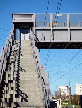 Metal pedestrian bridge stairs leading to skywalk. in Cete, Portugal - Norte