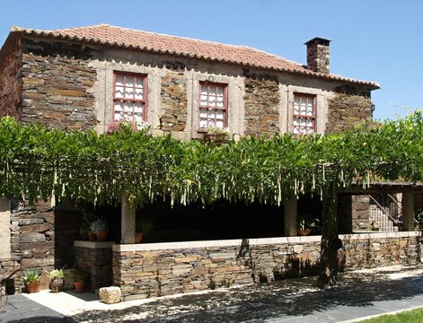 Traditional schist house with pergola in the Portuguese village of Quintadona, Portugal - Norte